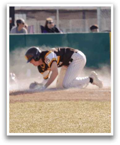 A baseball player slides into a base, kicking up dust. AI generated content