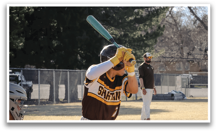 A baseball player is at bat, holding a bat and getting ready to swing. AI generated content
