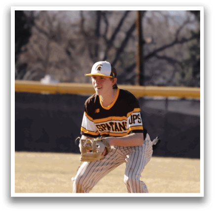 A baseball player in a black and yellow uniform is crouching on the field, ready to catch the ball. AI generated content
