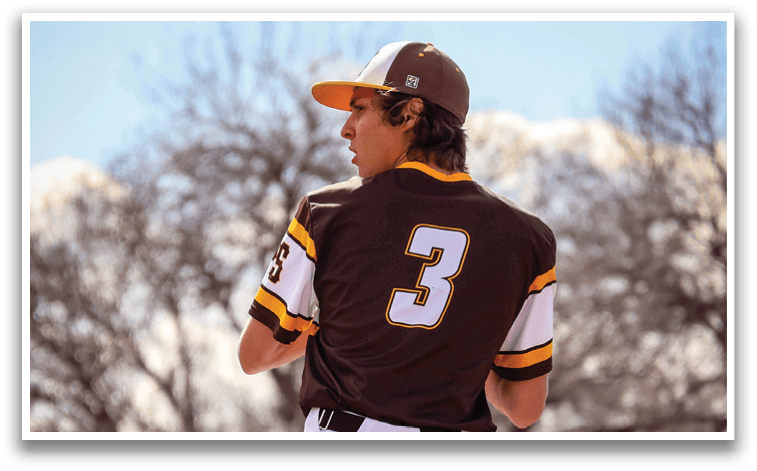 A man wearing a brown and white baseball uniform is throwing a ball. AI generated content