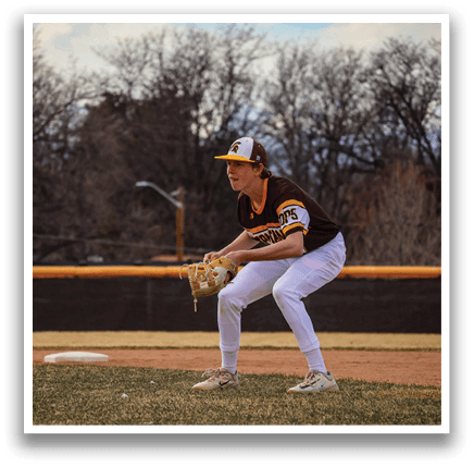 A baseball player in a brown and yellow uniform is kneeling on the field, holding a baseball glove. AI generated content