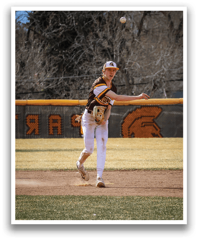 A baseball player in a brown and white uniform is pitching a ball. AI generated content