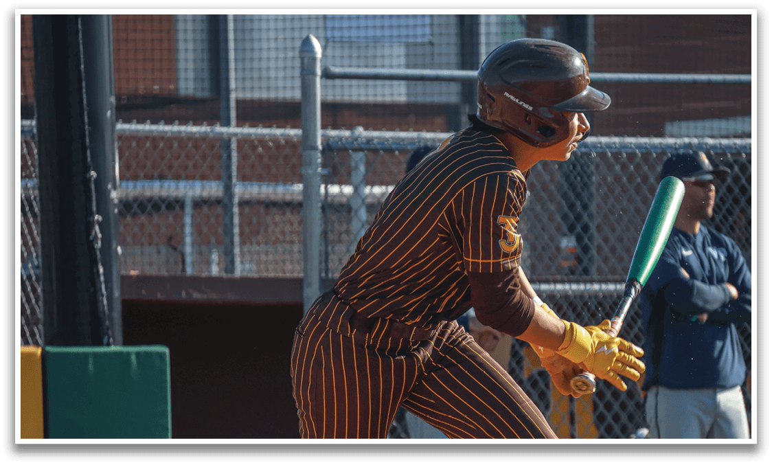 A baseball player in a striped uniform is swinging a bat, attempting to hit the ball. AI generated content