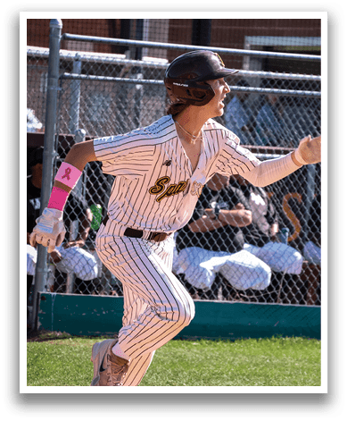 A baseball player in a striped uniform is running towards home plate. AI generated content