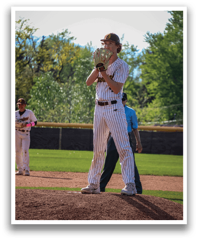 A baseball player in a striped uniform stands on the pitcher's mound, holding a baseball glove. AI generated content