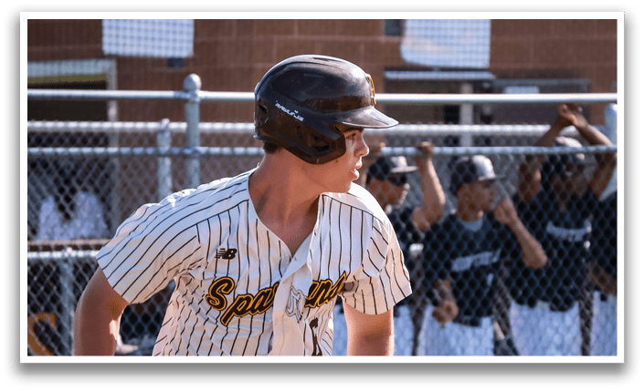 A baseball player wearing a grey helmet and a white and grey uniform is running on the field. AI generated content