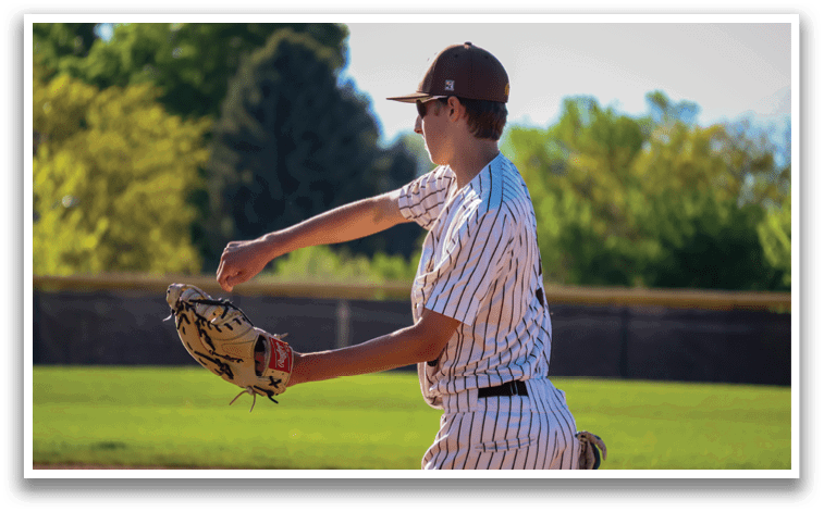 A baseball player in a striped uniform is in the process of throwing a ball. AI generated content