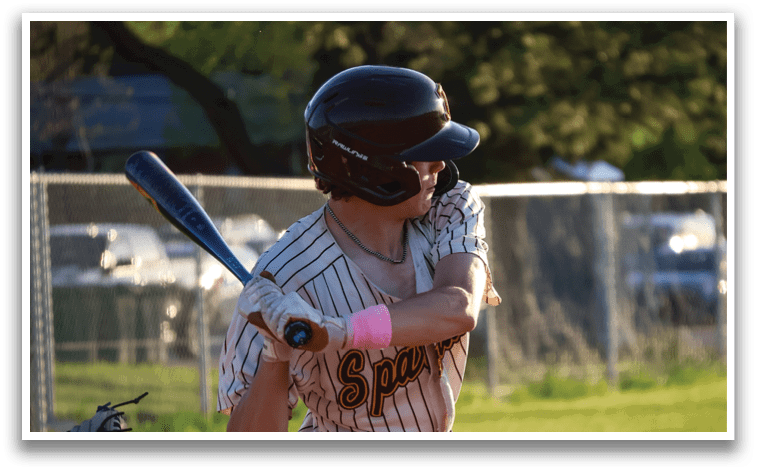 A baseball player is holding a bat and getting ready to swing. AI generated content