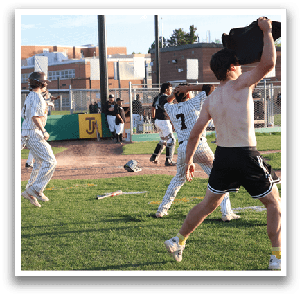 A group of young men are playing baseball on a field. One of the players is shirtless, and another is holding a baseball bat. AI generated content