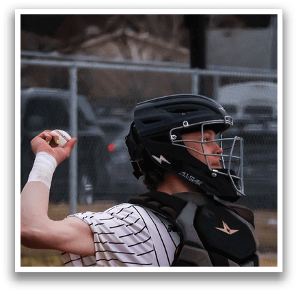 A baseball player in a catcher's position, wearing a helmet and a chest protector, preparing to catch a ball. AI generated content