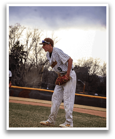 A baseball player wearing a striped uniform stands on the field, holding a baseball glove. AI generated content