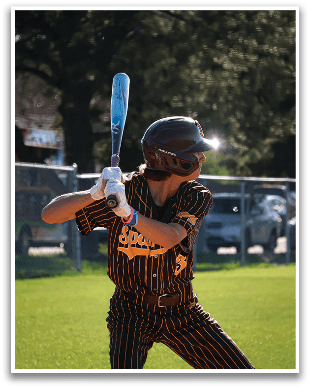 A baseball player in a striped uniform is swinging a bat at a ball. AI generated content