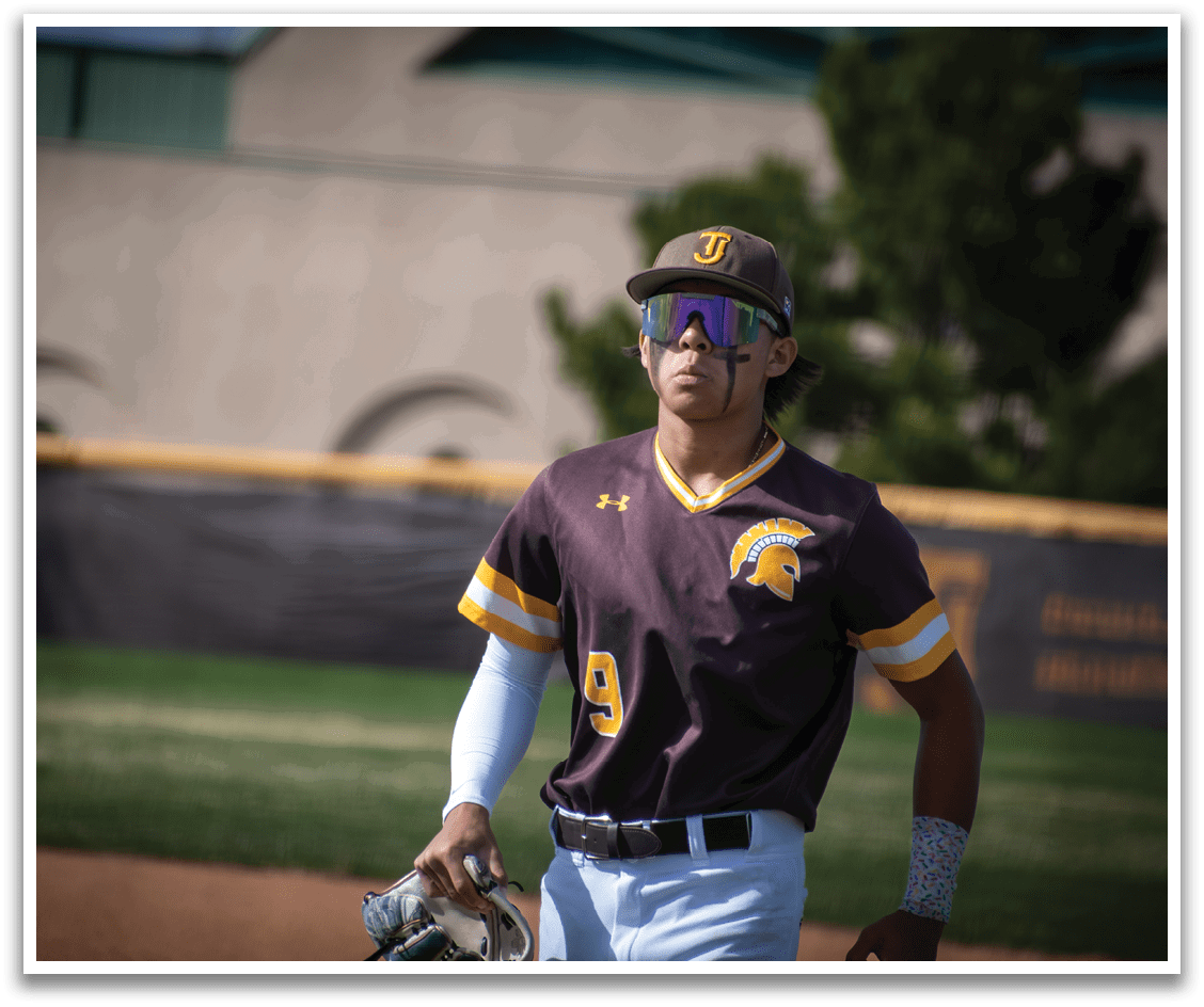 A baseball player wearing a brown and yellow jersey with the number 9 on it. AI generated content