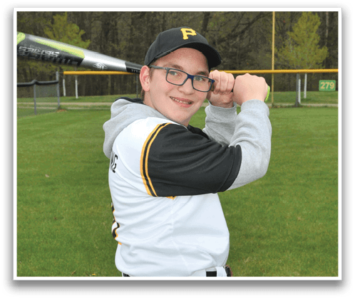 A young boy in a baseball uniform is holding a bat and smiling. AI generated content