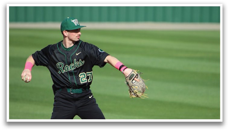 A baseball player in a black shirt and pink wristbands is running towards a base. AI generated content