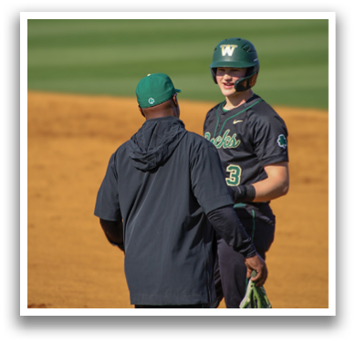 Two baseball players on a field, one wearing a green hat and the other wearing a black hat. AI generated content