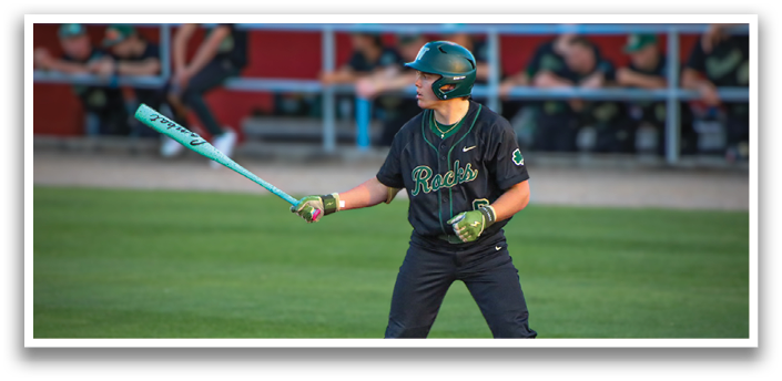 A baseball player in a black jersey and green helmet is holding a bat and getting ready to swing. AI generated content