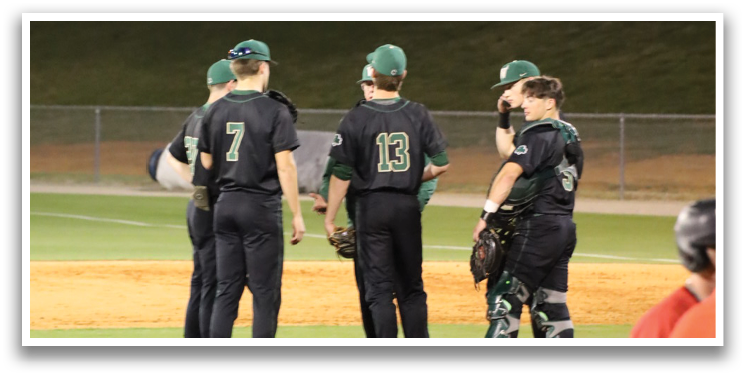 A group of baseball players wearing black uniforms are standing on the field. AI generated content