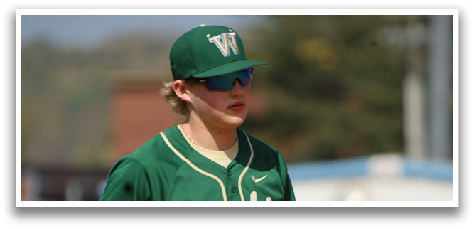 A baseball player in a green and white uniform is running on the field. AI generated content