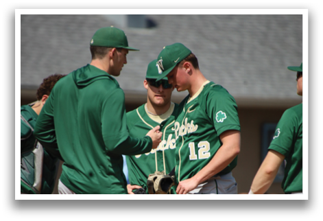 A group of baseball players standing on the field, some of them wearing green and white uniforms. AI generated content