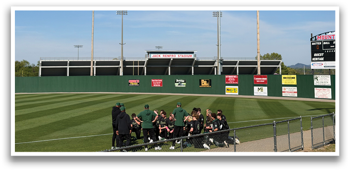 A group of people are sitting on a bench in a baseball field. AI generated content