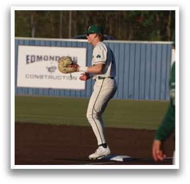 A baseball player in a green shirt and white pants is running towards a base. AI generated content