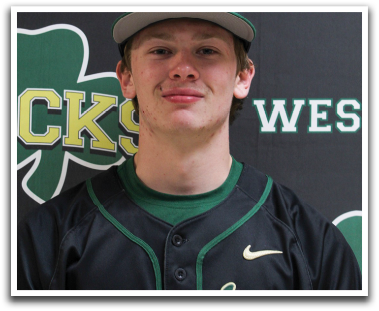 A man wearing a baseball uniform stands in front of a green and white banner. AI generated content