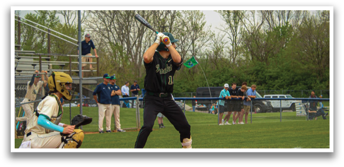 A baseball player is at bat, holding a bat and preparing to swing. AI generated content