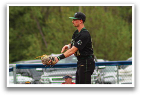 A baseball player is standing on the field, wearing a black shirt and holding a baseball glove. AI generated content