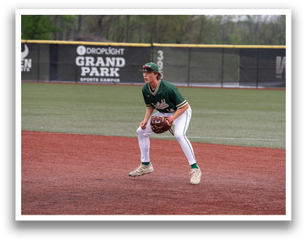 A baseball player is standing on the field wearing a green and white uniform. He is holding a baseball glove and appears to be ready to catch a ball. AI generated content