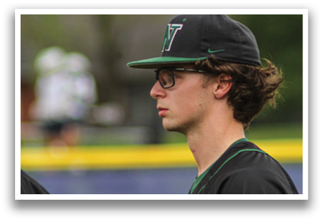 A baseball player wearing a black and green jersey with the number 22 on the back. AI generated content