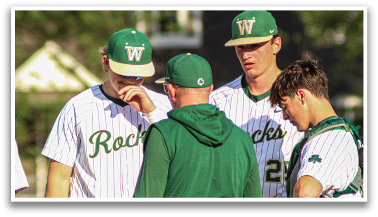A group of baseball players wearing green and white uniforms are standing together on a field. AI generated content