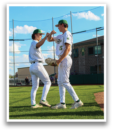 Two baseball players are high-fiving each other on the field. AI generated content