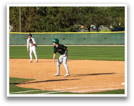 A baseball player in a green helmet is running towards first base. AI generated content