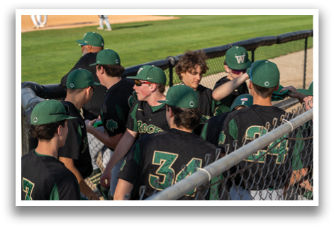 Baseball players wearing green and black uniforms are gathered on the field. AI generated content