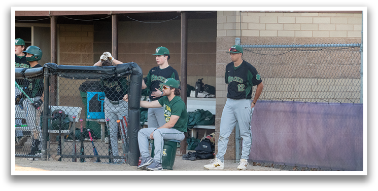 Baseball players sitting on benches, one of them holding a baseball bat. AI generated content