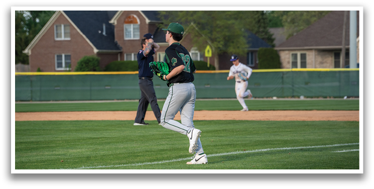 A baseball player in a green shirt and white pants is running towards a base. AI generated content