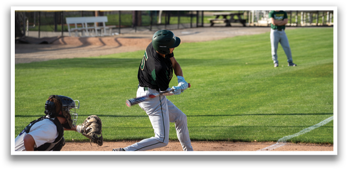 A baseball player is swinging a bat, attempting to hit the ball. The catcher is positioned behind him, ready to catch the ball if the player misses. There are several cars parked in the background, and a bench can be seen in the distance. AI generated content