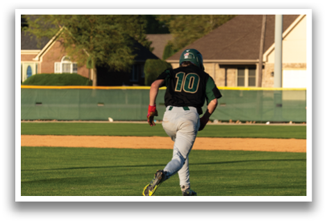 A baseball player is running on the field, wearing a green shirt and red shorts. AI generated content
