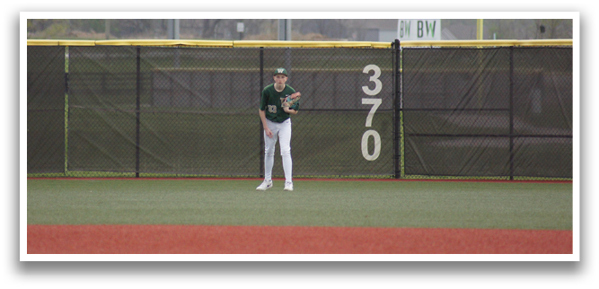A baseball player stands on a field, holding a baseball glove, in front of a fence. AI generated content