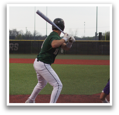 A baseball player in a green shirt and white pants is swinging a bat at a ball. AI generated content