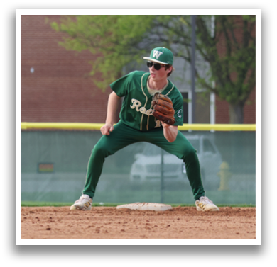 A baseball player in a green and white uniform is crouching on the field, ready to catch a ball. AI generated content