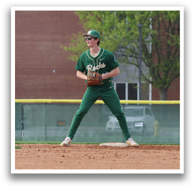 A baseball player in a green uniform is standing on a field, holding a baseball glove. AI generated content