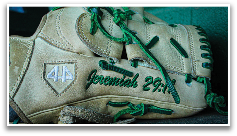A baseball glove with the name “Jeremiah 29:11" written on it. AI generated content