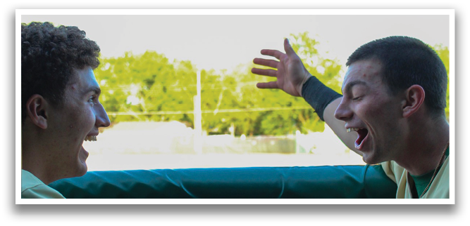 Two baseball players are laughing and shaking hands over a fence. AI generated content