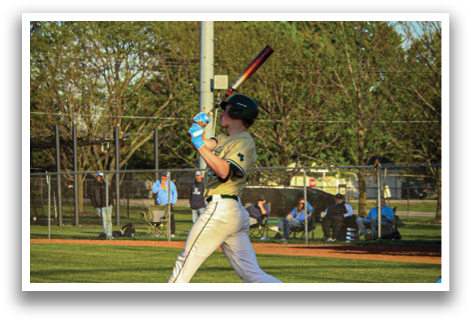 A baseball player in a white uniform is swinging a bat at a ball. AI generated content