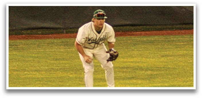 A baseball player in a white uniform is standing on a field, holding a baseball glove. AI generated content