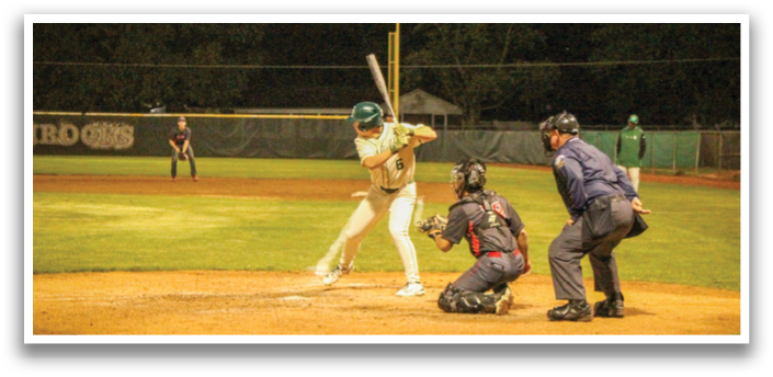 A baseball player is swinging a bat at a ball during a game. AI generated content