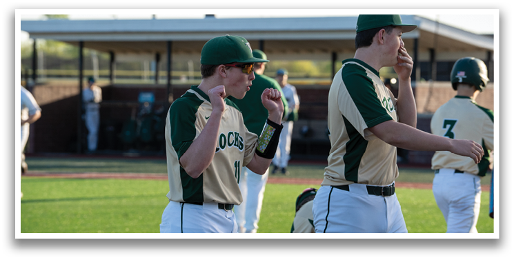 A group of baseball players on a field, one of them is wearing a green helmet. AI generated content