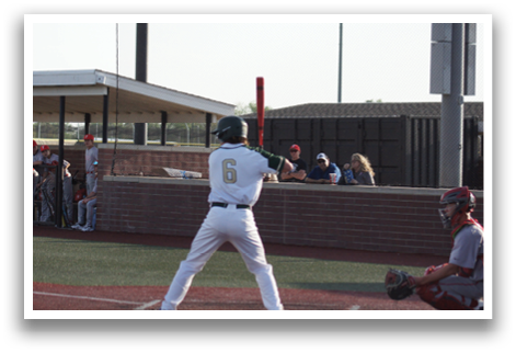 A baseball player in a green and white uniform is swinging a bat at a ball. AI generated content